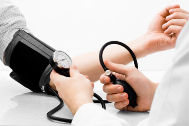 Doctor measuring patient's blood pressure